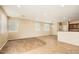 Open floor plan featuring tile and wood flooring, recessed lighting, and neutral paint at 14544 W Sierra St, Surprise, AZ 85379