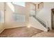 Bright living room featuring two-story ceilings, hardwood floors, and large windows at 14544 W Sierra St, Surprise, AZ 85379