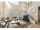 Living room showcasing a comfortable seating arrangement, high ceilings, and modern decor at 14544 W Sierra St, Surprise, AZ 85379