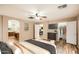 Spacious main bedroom featuring wood floors, walk-in closet, and ensuite bathroom for ultimate convenience at 14544 W Sierra St, Surprise, AZ 85379