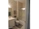 Bathroom with tub-shower combo, marble wallpaper, and neutral tile flooring at 15104 W Pinehurst W Ln, Surprise, AZ 85374