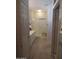Bathroom features a glass-enclosed shower, vanity with a white countertop and a large mirror at 15104 W Pinehurst W Ln, Surprise, AZ 85374