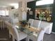 Dining room with glass table, seating for six, and bright, airy feel at 15104 W Pinehurst W Ln, Surprise, AZ 85374