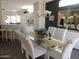 Dining room with glass table, seating for six, and bright, airy feel at 15104 W Pinehurst W Ln, Surprise, AZ 85374