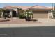 Charming single-story home featuring a well-maintained landscape and a two-car garage at 15104 W Pinehurst W Ln, Surprise, AZ 85374