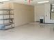 Spacious garage featuring built-in cabinets and shelving for ample storage solutions at 15104 W Pinehurst W Ln, Surprise, AZ 85374