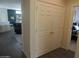 Hallway view of living room and bedroom, showcasing the home's open layout at 15104 W Pinehurst W Ln, Surprise, AZ 85374