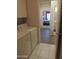 Laundry room includes a washer, dryer, storage, and tile flooring at 15104 W Pinehurst W Ln, Surprise, AZ 85374