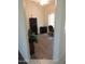 Home office features modern black desk and cabinetry, bright window, and wood-look flooring at 15104 W Pinehurst W Ln, Surprise, AZ 85374