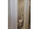 Powder room features a toilet, tile flooring, and neutral walls at 15104 W Pinehurst W Ln, Surprise, AZ 85374