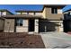 Inviting two-story home with a well-maintained front yard, covered entry, and attached two car garage at 17552 W Lupine Ave, Goodyear, AZ 85338