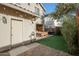 Private backyard oasis with artificial turf, patio area, string lights, and outdoor dining at 18841 E Pelican Ct, Queen Creek, AZ 85142
