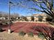 Outdoor community basketball court with well-maintained surface and surrounding landscaping at 20040 E Kestrel St, Queen Creek, AZ 85142