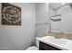 Tastefully designed half-bathroom featuring framed wood art piece, stylish mirror and modern sink at 20040 E Kestrel St, Queen Creek, AZ 85142