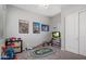 Playful bedroom with 'Cars' themed decor, complete with a race track and organized toy storage at 20040 E Kestrel St, Queen Creek, AZ 85142