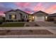 Charming single-story home with manicured lawn and a two-car garage at 20040 E Kestrel St, Queen Creek, AZ 85142