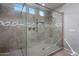 Modern walk-in shower featuring stylish tile work, glass enclosure, multiple shower heads, and ample space at 20040 E Kestrel St, Queen Creek, AZ 85142