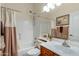 Bathroom featuring a shower-tub combination, single sink and mirror at 20331 N Fletcher Way, Peoria, AZ 85382