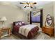 Cozy bedroom featuring stylish decor, ceiling fan, and natural light at 20331 N Fletcher Way, Peoria, AZ 85382