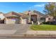 Charming single-story home featuring a three-car garage and well-manicured lawn in a desirable community at 20331 N Fletcher Way, Peoria, AZ 85382