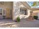 Inviting front patio features a decorative fountain and a charming, landscaped walkway to the front door at 20331 N Fletcher Way, Peoria, AZ 85382
