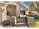 Welcoming front entrance with stone accents, a decorative door, and a charming walkway fountain at 20331 N Fletcher Way, Peoria, AZ 85382