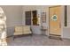 Cozy front porch with a comfortable seating area and a decorative welcome mat near the front door at 20331 N Fletcher Way, Peoria, AZ 85382