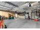 Spacious and well-organized garage with storage solutions and ample room for vehicles at 20331 N Fletcher Way, Peoria, AZ 85382