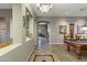 Spacious hallway featuring an archway leading into other rooms and a game room on the side at 20331 N Fletcher Way, Peoria, AZ 85382