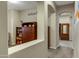 Hallway view leading to bedroom, showcasing architectural details and a glimpse of a cozy space at 20331 N Fletcher Way, Peoria, AZ 85382