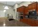Bright kitchen featuring granite countertops, stainless steel appliances, and dark wood cabinets at 20331 N Fletcher Way, Peoria, AZ 85382