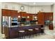 Spacious kitchen features an island with seating and modern stainless steel appliances at 20331 N Fletcher Way, Peoria, AZ 85382