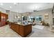 Open floor plan with a spacious kitchen island and living area filled with natural light at 20331 N Fletcher Way, Peoria, AZ 85382
