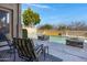 Inviting pool area with comfortable seating, stone accents, and serene views, perfect for relaxation and entertainment at 20331 N Fletcher Way, Peoria, AZ 85382