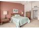 Cozy bedroom with a comfortable bed, bedside tables and soft carpet at 20408 N Tanglewood Dr, Sun City West, AZ 85375