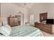 Cozy bedroom with a comfortable bed, carpet, and dresser with mirror at 20408 N Tanglewood Dr, Sun City West, AZ 85375