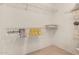 Walk-in closet with shelving and hanging rods at 20408 N Tanglewood Dr, Sun City West, AZ 85375