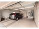 Spacious garage with room for parking, storage, and equipped with built in cabinets at 20408 N Tanglewood Dr, Sun City West, AZ 85375