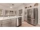 The kitchen features tile floors, stainless appliances, and ample cabinets at 20408 N Tanglewood Dr, Sun City West, AZ 85375