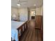 Bedroom featuring a patterned bedspread, wood floors, and a view to the bathroom at 2102 W Marlette Ave, Phoenix, AZ 85015