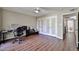 Bedroom featuring a ceiling fan, wood floors, and a large closet at 2102 W Marlette Ave, Phoenix, AZ 85015