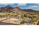 Aerial view of a beautiful neighborhood with mountain views and private pools at 2202 E Lincoln Dr, Phoenix, AZ 85016