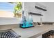 Well-lit bar area with decorative liquor bottles and ample counter space at 2202 E Lincoln Dr, Phoenix, AZ 85016