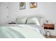 This bedroom features a floating nightstand, light wood floors and modern décor at 2202 E Lincoln Dr, Phoenix, AZ 85016