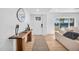 Bright entryway with wood floors, stylish console table, modern decor and entry door at 2202 E Lincoln Dr, Phoenix, AZ 85016