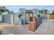 Charming gated front entrance featuring decorative ironwork, desert landscaping and walkway to front door at 2202 E Lincoln Dr, Phoenix, AZ 85016