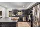 Stylish kitchen featuring sleek black cabinets and stainless steel appliances at 2202 E Lincoln Dr, Phoenix, AZ 85016