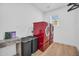 Convenient laundry room featuring a modern red washer and dryer and wood-look floors at 2202 E Lincoln Dr, Phoenix, AZ 85016