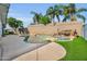 Backyard pool with a rock waterfall feature and plenty of space for outdoor entertaining at 2202 E Lincoln Dr, Phoenix, AZ 85016