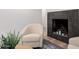 Cozy seating area with fireplace, comfortable chairs, and stylish design elements at 2202 E Lincoln Dr, Phoenix, AZ 85016